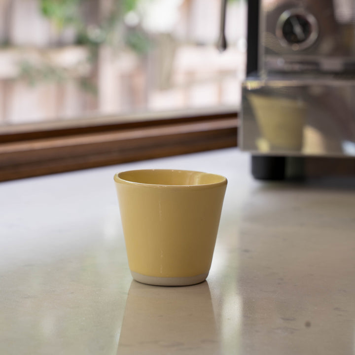 Yellow ceramic espresso cup